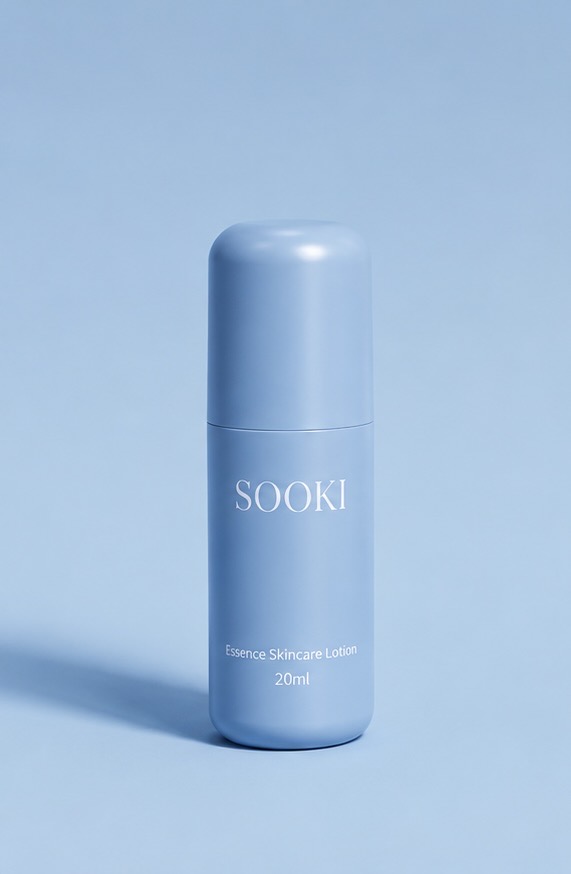 Sooki serum bottle on a travertine slab with silk and dried florals